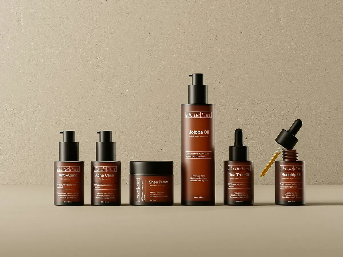 Amber glass skincare bottles and jars arranged on a neutral backdrop
